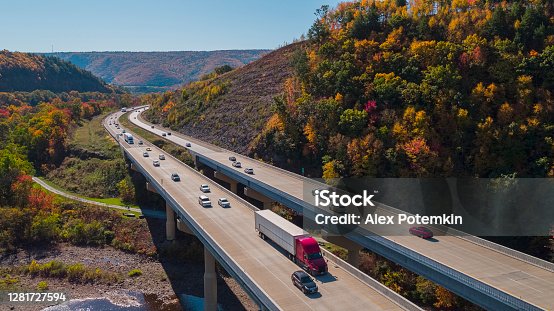 istock Scenic aerial view of the high bridge at the Pennsylvania Turnpike lying between mountains in Appalachian on a sunny day in fall. 1281727594