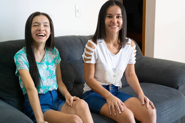istock Mother and daughter with disability 1281729578