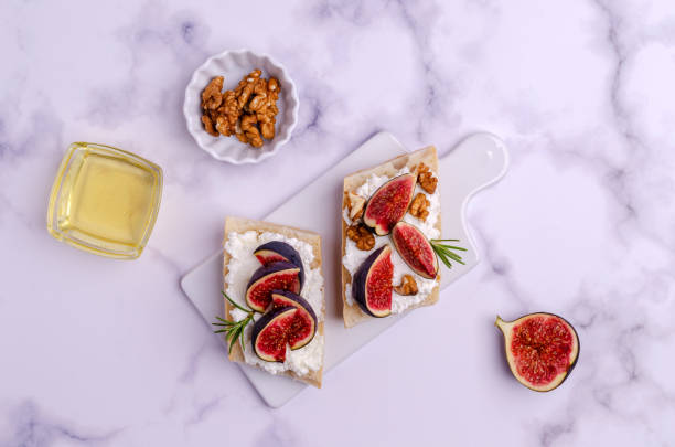 istock Sandwich with white cream, figs and honey 1281738506