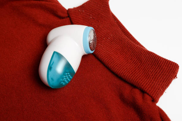 istock Device for removing lint from wool clothes. Golf with fuzz ball isolated on white background. 1281741134
