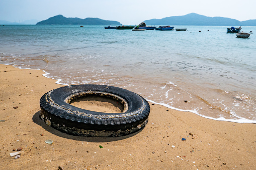 Black tires on the beach