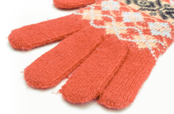 istock Red woolen gloves on white background. Womanly clothes 1281747297