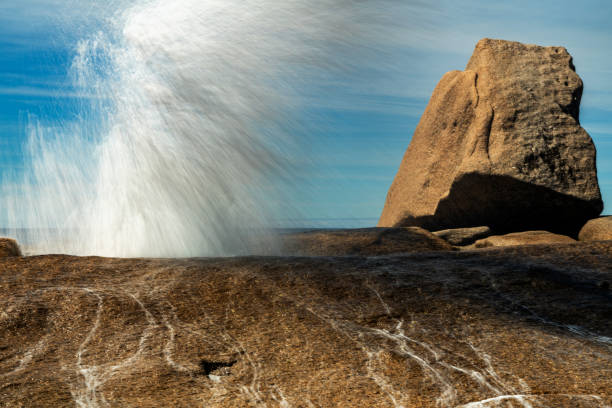 istock Hole emitting powerful water jets, Bicheno Blowhole, Tasmania, Australia 1281747962