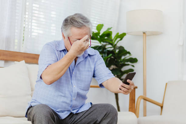 istock Asian senior fatigue man taking off glasses during using smartphone 1281751646