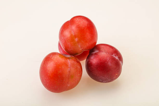 Ripe sweet tasty red plum heap