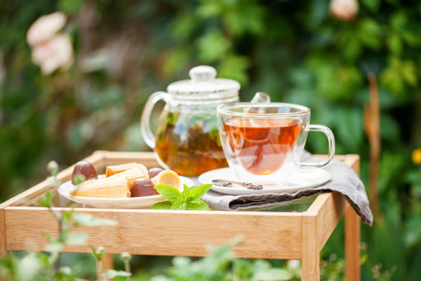 istock Cup of tea  in a garden 1281752610