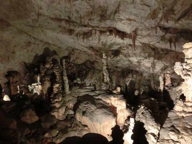 istock Picturesque karst features illuminated in the cave, Postojna grotte 1281753501