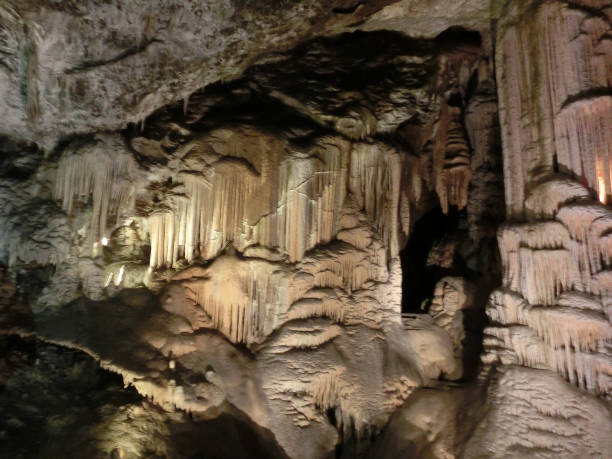 istock Picturesque karst features illuminated in the cave, Postojna grotte 1281753529