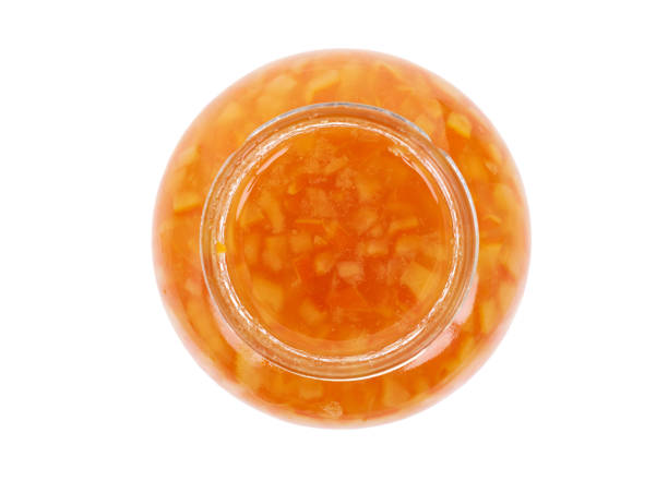 istock Orange homemade jam isolated on white background. Top view. 1281757322