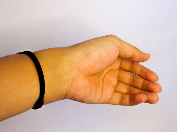 istock bracelet in black pearl holding on hand on white background 1281758063
