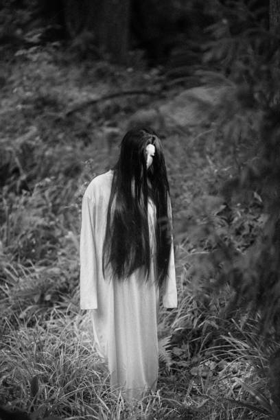 istock Spooky Japanese ghost woman in a forest 1281759275