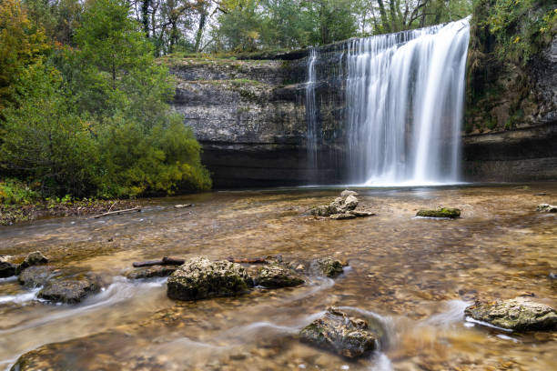 istock beautiful fall forest landscape with idyllic waterfall and pool 1281759967