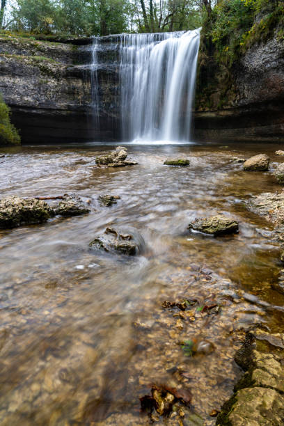 istock beautiful fall forest landscape with idyllic waterfall and pool 1281759995
