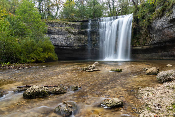 istock beautiful fall forest landscape with idyllic waterfall and pool 1281760088