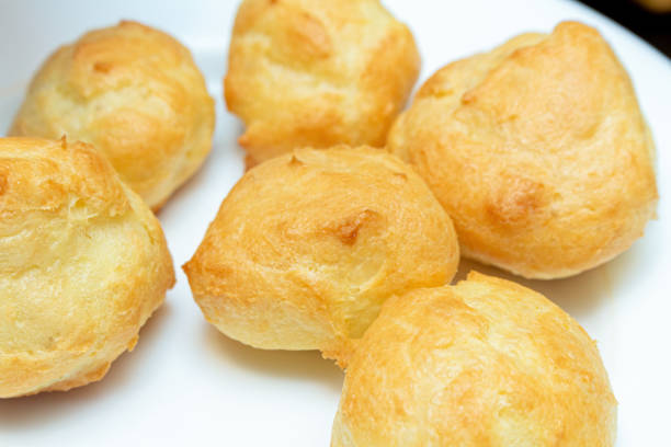 istock homemade profiteroles on a white plate close up 1281761596