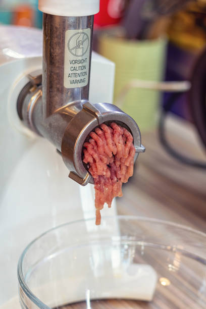 istock cooking minced meat with onions and crackers on a white meat grinder or mincer 1281761609