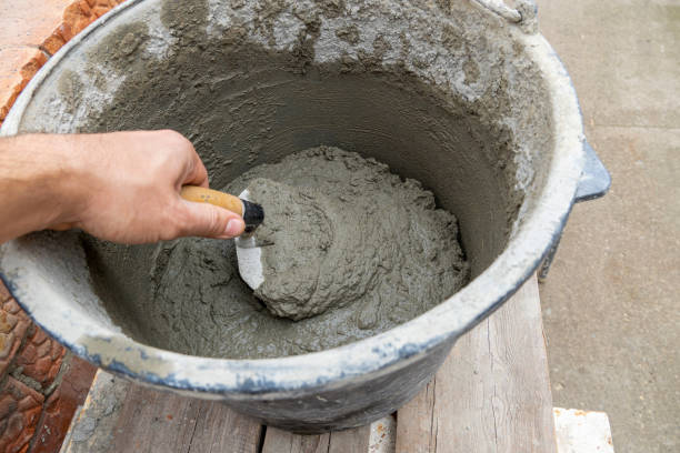 istock Cement-sand concrete mix in a plastic bucket with a trowel 1281761747