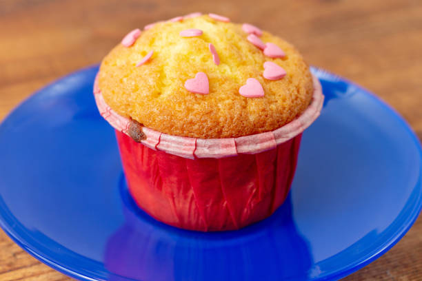 delicious cupcakes with heart-shaped confectionery