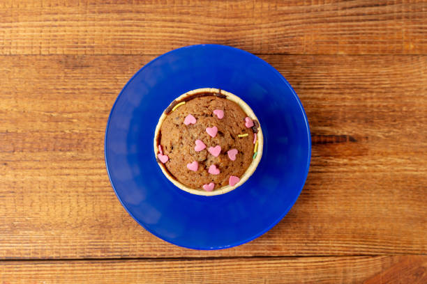 delicious cupcakes with heart-shaped confectionery