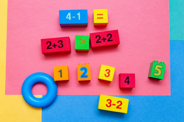 istock child kid colorful education toys cubes with numbers math pattern background on the bright background. Flat lay. Childhood infancy children babies concept. 1281761911