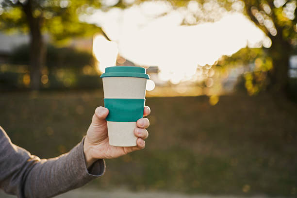 istock Man hold reusable coffee cup in their hands 1281762854
