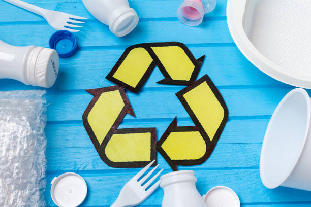 istock white plastic waste with recycling on blue background. Eco concept with copy space 1281763097