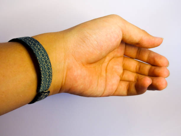 istock bracelet in green batik holding on hand on white background 1281764140