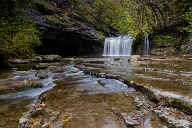 istock beautiful fall forest landscape with idyllic waterfall and river steps 1281764170