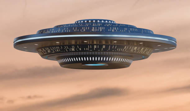 istock UFO alien spaceship in sky at sunset. 3D rendered illustration. 1281765670