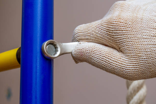 istock Assembling installing home gymnastic wall bars on the floor. Sport gym home concept 1281767893