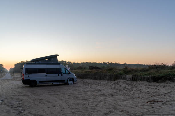 istock camper van parked at an idyllic beach access at sunrise 1281767918