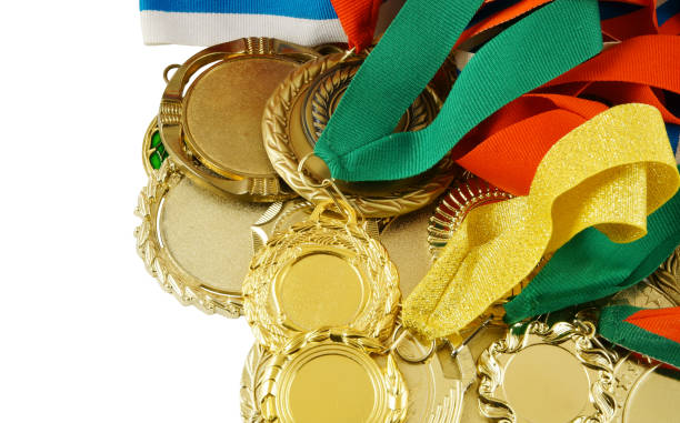 istock Gold medals isolated on white 1281768347