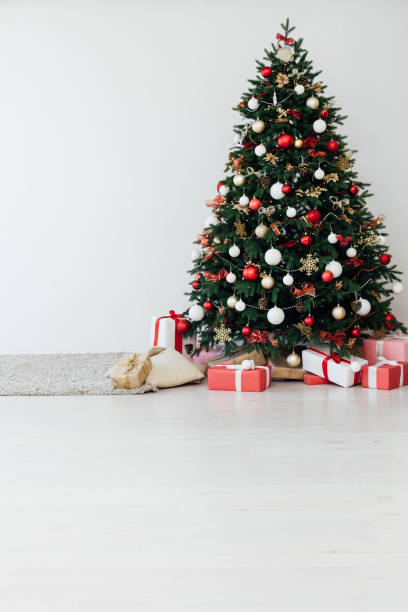 istock Christmas tree with gift decor for new year interior holiday card 1281770061