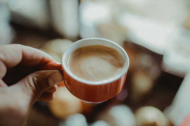 istock Close-Up Of Hand Holding Coffee Cup 1281771295