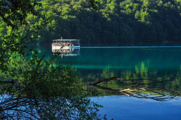 Tourist boat on lake - Plitvice lakes national park in Croatia.