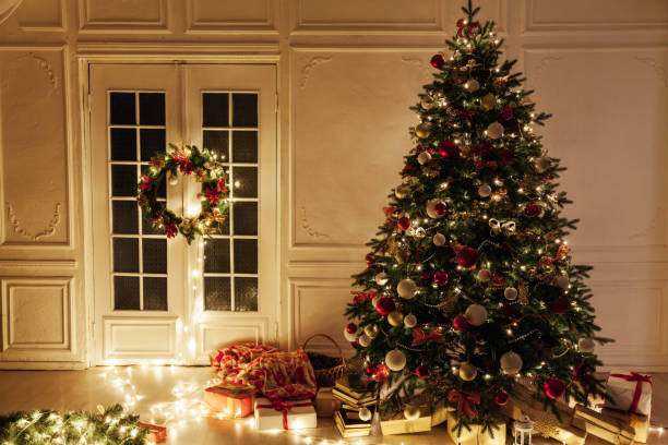 istock Christmas tree shines lights garlands New Year's Night warm light 1281771761