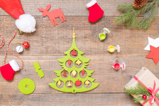 istock How to make a Christmas tree from a wooden blank. DIY concept. Step by step photo instruction. Step 4 decorate the tree with toys 1281772243