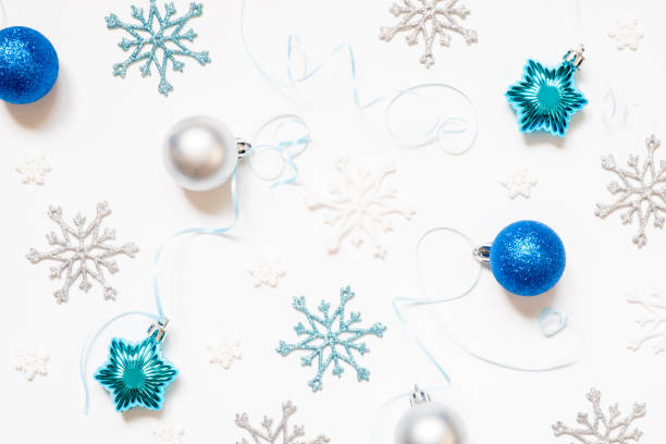 istock Christmas or New Year's composition 2021. Beautiful xmas blue and silver decorations on a white background. Greeting card mockup. Flat lay 1281772247