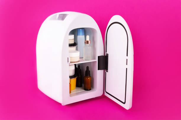 istock Mini fridge on vivid magenta background. Minimal composition. 1281773878
