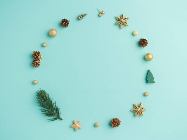 istock Christmas wreath with golden decoration on light blue background 1281776660