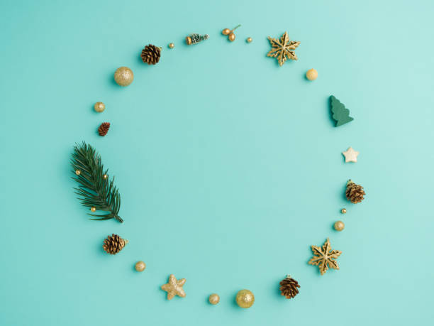 istock Christmas wreath with golden decoration on light blue background 1281776682