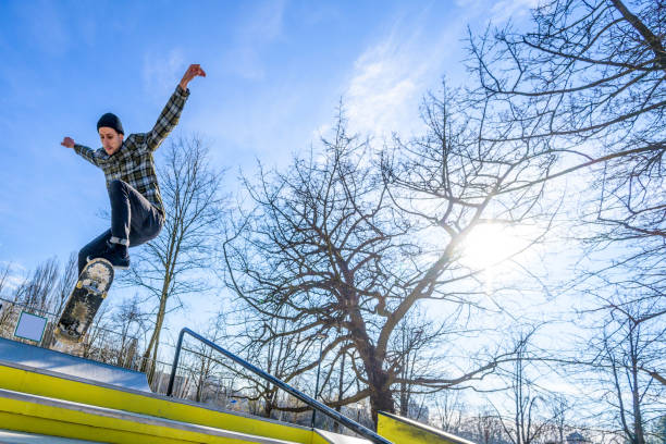 istock Young man skateboarding in park 1281777174
