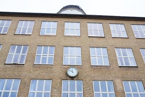 school building with a big clock on the building