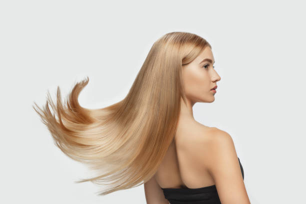 Beautiful Model With Long Smooth Flying Blonde Hair Isolated On White  Studio Background Stock Photo - Download Image Now - iStock