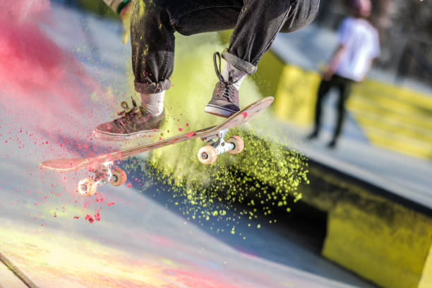 young woman skateboarding in park - 4369 imagens e fotografias de stock