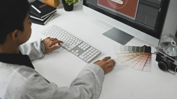 istock A young graphic designer woman using colour swatch samples for work  at her work space. 1281780158