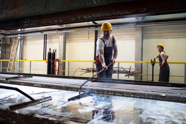 istock Factory worker melting metal in production industry. 1281782478