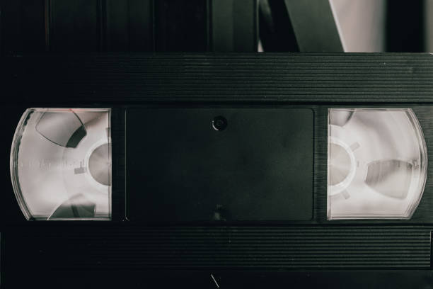 istock Stack of VHS video tapes as background. Old video cassettes tapes. Retro technology. 1281783459