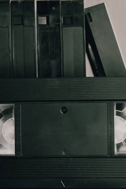 istock Stack of VHS video tapes as background. Old video cassettes tapes. Retro technology. 1281783468