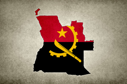Grunge map of Angola with its flag printed within its border on an old paper.